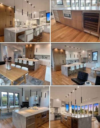 Modern open-concept kitchen with island, pendant lights, wood floors, large windows, and built-in wine fridge